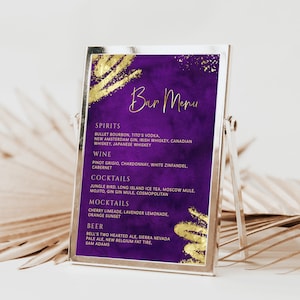 May include: A purple bar menu with gold accents, displayed in a silver frame. The menu lists spirits, wine, cocktails, mocktails, and beer options. The text is in a stylish font, with a watercolor-like background.