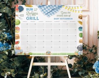 Op de afbeelding: Een witte kalender op een houten ezel met de tekst "Bun in the oven and Burgers on the Grill" en "Guess the arrival date of BABY HUTCHINSON." De kalender heeft illustraties van eten en een blauw ruitpatroon.