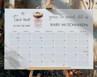 May include: A white calendar with a pink ribbon and a glass of chocolate drink with whipped cream and chocolate sprinkles. The calendar is for guessing the arrival date of Baby Hutchinson. The calendar starts on March 30th and ends on May 3rd.