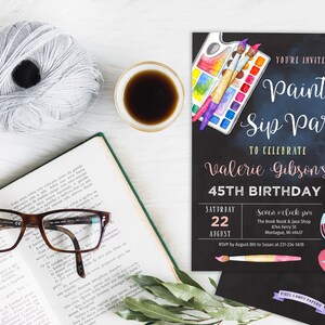 May include: A black chalkboard style invitation to a paint and sip party to celebrate Valerie Gibson's 45th birthday. The invitation features watercolor illustrations of paintbrushes, a paint palette, and wine glasses. The party is scheduled for Saturday, August 22nd at 7:00 pm at The Book Nook & Java Shop in Montague, MI 49437. RSVP by August 8th to Susan at 231-234-5678.
