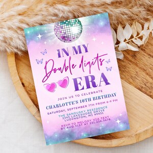 May include: A pink and purple birthday invitation with a disco ball and the text "In My Double Digits Era". The invitation is for Charlotte's 10th birthday party on September 7th from 6-9 PM at The Sandusky Residence, 2345 Lakeshore Drive, Ludington, MI 49431. RSVP to Melody via text by August 31st at 231.234.5678.