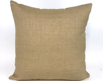 Woven straw-colored outdoor pillow cover