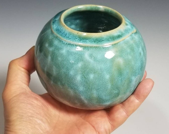 Jar with a variegated blue-green glaze.