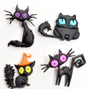 May include: Four black cat figurines with different eye colors and tail styles. The cats have a whimsical, cartoonish style.