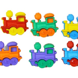 May include: Six colorful plastic toy train buttons. The trains are red, green, yellow, orange, purple, and blue. Each train has a black chimney and wheels.