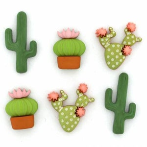 May include: Six different cactus buttons with green and pink colors. The buttons are made of plastic and have a flat back. They are perfect for adding a touch of whimsy to your crafts.