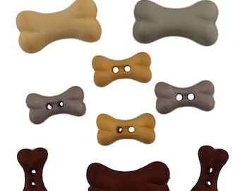 May include: Assortment of plastic dog bone buttons in various colors, including brown, beige, gray, and purple. The buttons have two holes each.