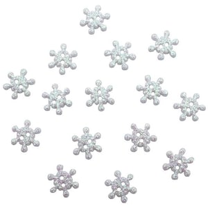 May include: A collection of snowflake-shaped buttons with a glittery, iridescent finish. Each button has six points and four holes for sewing. The buttons are a light silver color and are scattered across a white background.