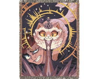 May include: A rectangular woven throw blanket featuring a dark background with a central illustration of a light-colored cat with large amber eyes and a crown, positioned above a person with a determined expression, surrounded by golden sunburst rays.