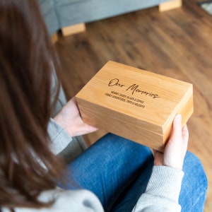 May include: A wooden box with the text "Our Memories" engraved on the top. The box is personalised with the names "Mummy, Daddy, Oliver & Sophia" and the text "Family Adventures, Trips & Holidays".