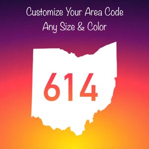 May include: A white silhouette of the state of Ohio featuring the orange numbers 614 centered within the shape. Above the state, the text reads Customize Your Area Code Any Size & Color against a gradient background of purple, red, and orange.