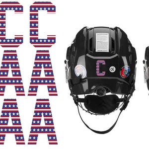 May include: Black hockey helmets with the letters "C" and "A" in red, white, and blue, resembling the American flag. The helmets have a visor and chin strap. The letters "C" and "A" are displayed on the back of the helmets.