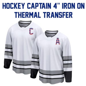 May include: Two white hockey jerseys with black sleeves and gray stripes. Each jersey has a letter in red, white, and blue on the chest. The text "HOCKEY CAPTAIN 4" IRON ON THERMAL TRANSFER" is at the top.