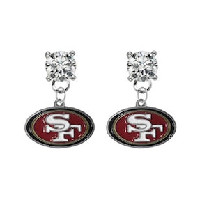 May include: Silver earrings with a red, white, and black San Francisco 49ers logo charm dangling from a clear crystal stud.