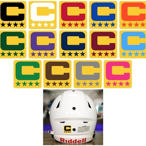 May include: A collection of yellow, square stickers with a letter "C" in various colors, each with a different number of stars. A white Riddell football helmet with a "C" sticker and the brand name "Riddell" in red.