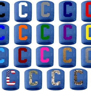 May include: Twenty blue wristbands with a white letter "C" in various colors and patterns, including black, white, gray, blue, orange, green, purple, yellow, light blue, maroon, pink, gold, silver, American flag, camouflage, money, and snake skin.