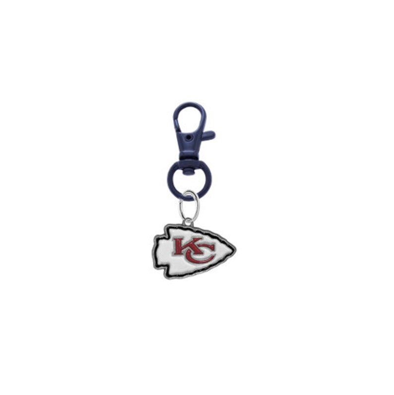 May include: A silver and red Kansas City Chiefs logo keychain with a blue metal clip.
