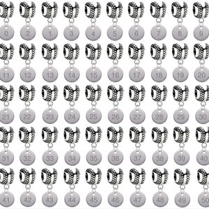 May include: Fifty silver charm beads with a tire tread design and a silver tag with a number from 0 to 50. The beads are arranged in five rows of ten beads each.