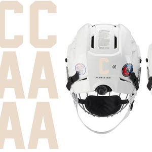 May include: White hockey helmets with black face masks and the letters "C" and "A" on the back. Beige letters "C" and "A" are also displayed. The helmets have straps and a chin cup.