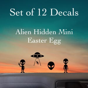 May include: A set of 12 decals featuring black silhouettes of aliens, a flying saucer with a tractor beam, and an alien head. The text reads Set of 12 Decals and Alien Hidden Mini Easter Egg. These decals are displayed against a sunset background.