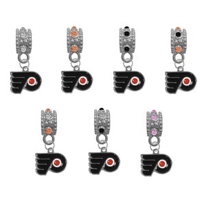 May include: Seven silver charm beads featuring a black and orange Philadelphia Flyers logo. Each bead has a different coloured crystal accent.