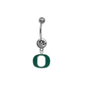 May include: A silver belly button ring with a clear crystal top and a green 'O' charm.