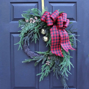 Pine and Cedar Wreath with Bells and golden berries.  Asymmetrical Holiday/Christmas Wreath