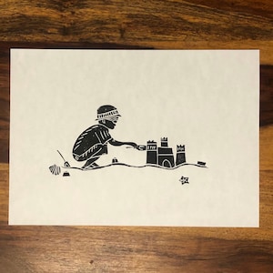 Building sandcastles - original lino cut
