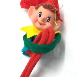 Japan vintage knee hugger Christmas ornament pixie rubber face elf 1960’s Christmas decor red green yellow