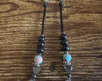 silver hair clips with beads and skull charms.