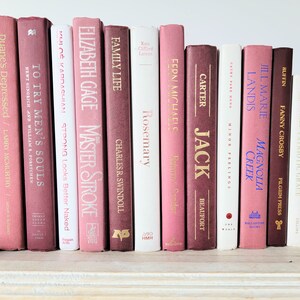 Purple books by the foot. Modern books. Dusty rose books. Display.