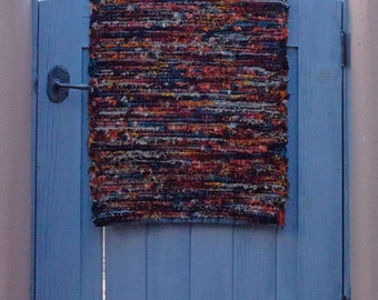 23.105. Red, Orange and Black Chorus Hand-Woven Wool Rug