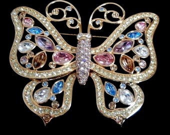 Grande broche papillon plaquée or signée Swarovski avec cristaux sertis lunette
