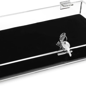 May include: A clear acrylic display case with a black velvet lining and a lock with a key. The case is perfect for displaying small items like jewelry or collectibles.