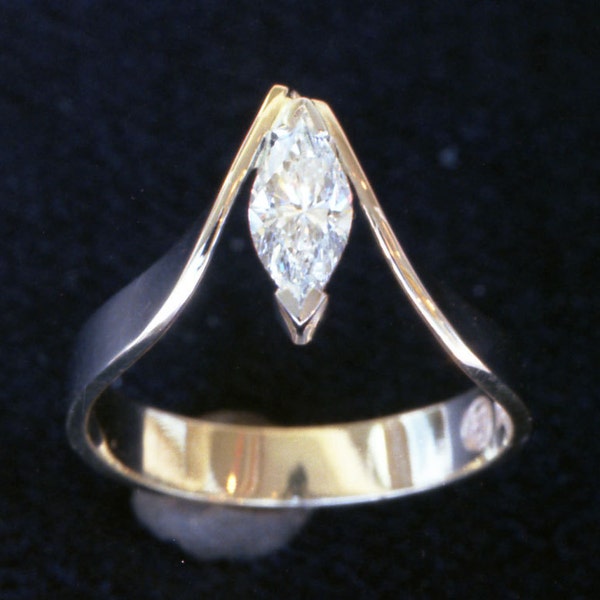Unique sweeping hand made Marquise cut Diamond recycled 18k hand forged gold and platinum engagement ring