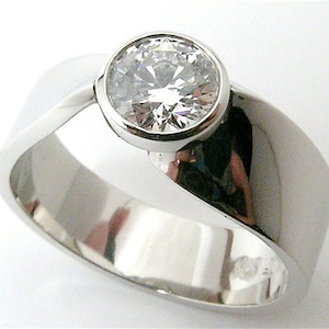 2/3 Carat Canadian Diamond Bezel set in 10% Iridium Platinum Eternal Twist Engagement ring.