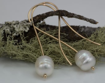 Baroque South Sea Pearls. High quality pearls suspended by 18K yellow gold
