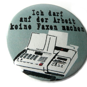 Button, magnet, bottle opener or compact mirror. Fax
