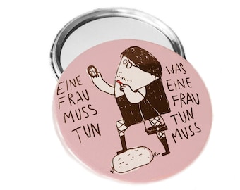 Eine Frau muss tun, was eine Frau tun muss. Pinback button, magnet, bottle opener or compact mirror.