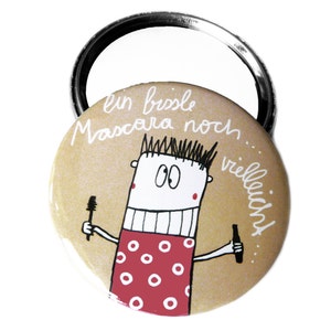 Button, magnet, pocket mirror or bottle opener. A little mascara perhaps