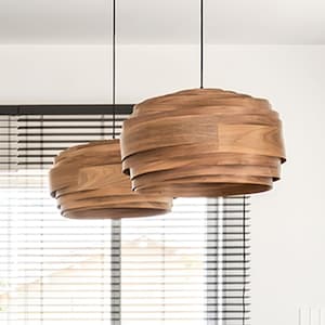 May include: A modern kitchen island with a light gray countertop and a wooden table top. Six orange bar stools surround the island. Two wooden pendant lights hang above the island.