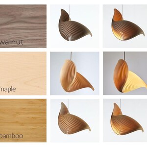 May include: Wooden pendant lights in walnut, maple, and bamboo. The lights have a unique, layered design, with a curved, leaf-like shape. The image also shows close-ups of the wood grains and the text "walnut", "maple", and "bamboo".