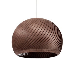 May include: A brown wooden pendant light with a curved, ribbed design.