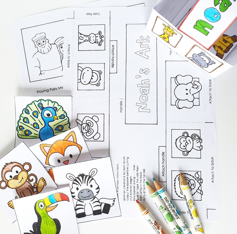 May include: A printable Noah's Ark craft activity for kids. The craft includes a base, handle, and animal cutouts. The animals include a monkey, zebra, toucan, fox, peacock, giraffe, panda, elephant, and a monkey. The craft is designed to be assembled by attaching the pieces together.