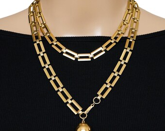 Trifari 1940-tals modernistiskt långt halsband med hänge i form av en orb-berlock 91 cm