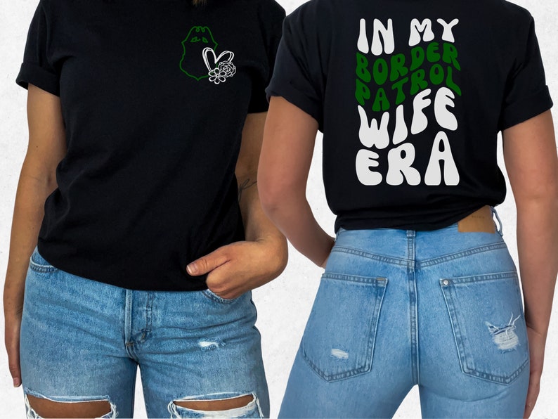 May include: Black t-shirt with a green outline of a badge and a heart with flowers on the left side. The back of the shirt has the text "IN MY BORDER PATROL WIFE ERA" in white with green outlines.