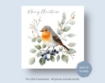 May include: A square greeting card featuring a watercolor illustration of a robin perched on a branch with green leaves and dark blue berries. The text Merry Christmas is printed in black script at the top. The card is part of a pack of 6 cards.
