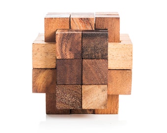 May include: A wooden puzzle with a cross shape. The puzzle is made of multiple pieces of wood that fit together to form a cross.