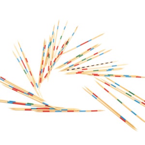 May include: A set of wooden sticks with colored bands, arranged in a circular pattern. The sticks are used for the game pick-up sticks.