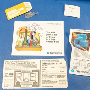 May include: A vintage Samsonite luggage tag with a registration form and a luggage protection plan. The tag is brown with white text and a blue Samsonite logo. The text on the tag reads "Samsonite Luggage Recommends... A FULL Tears Protection for only $5.00... REGISTRATION INFORMATION IMMEDIATELY!"